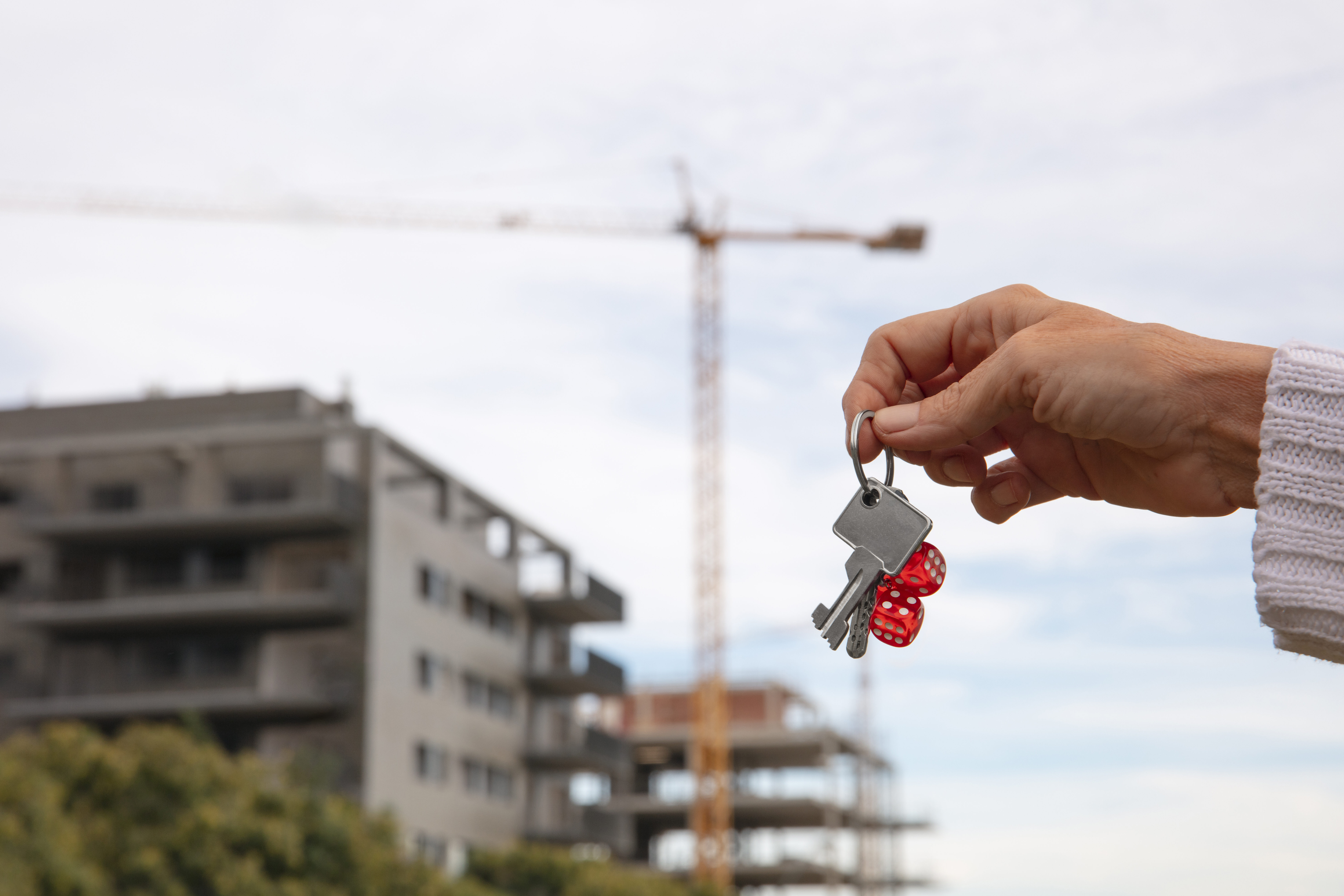 hand-holding-keys-outdoors